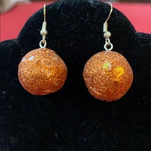 Sparkly orange glitter ball pierced earrings